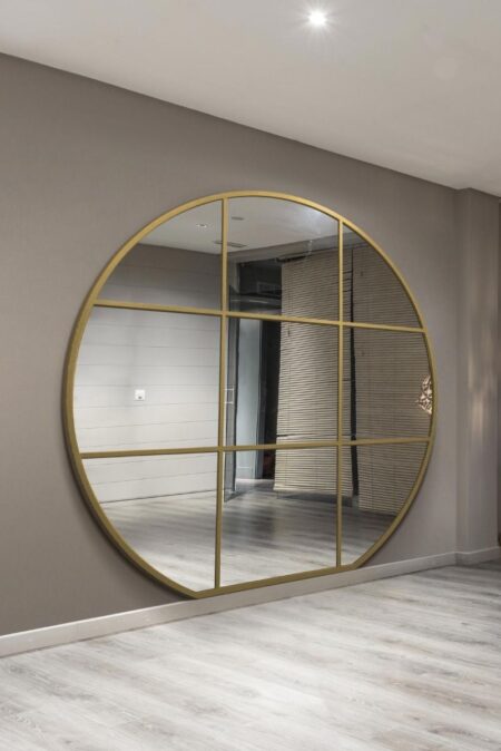 Extra Large Round Gold Metal Mirror with Window Grid – lifestyle room setting