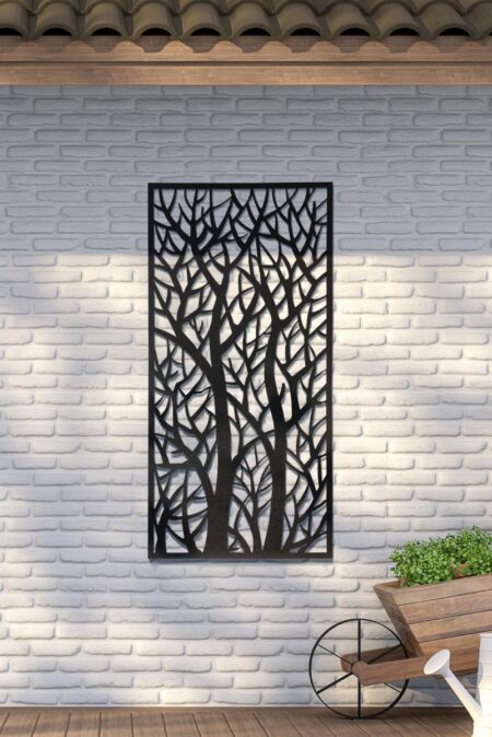Large garden metal wall art featuring a cut-out tree branch design mounted on a white brick wall